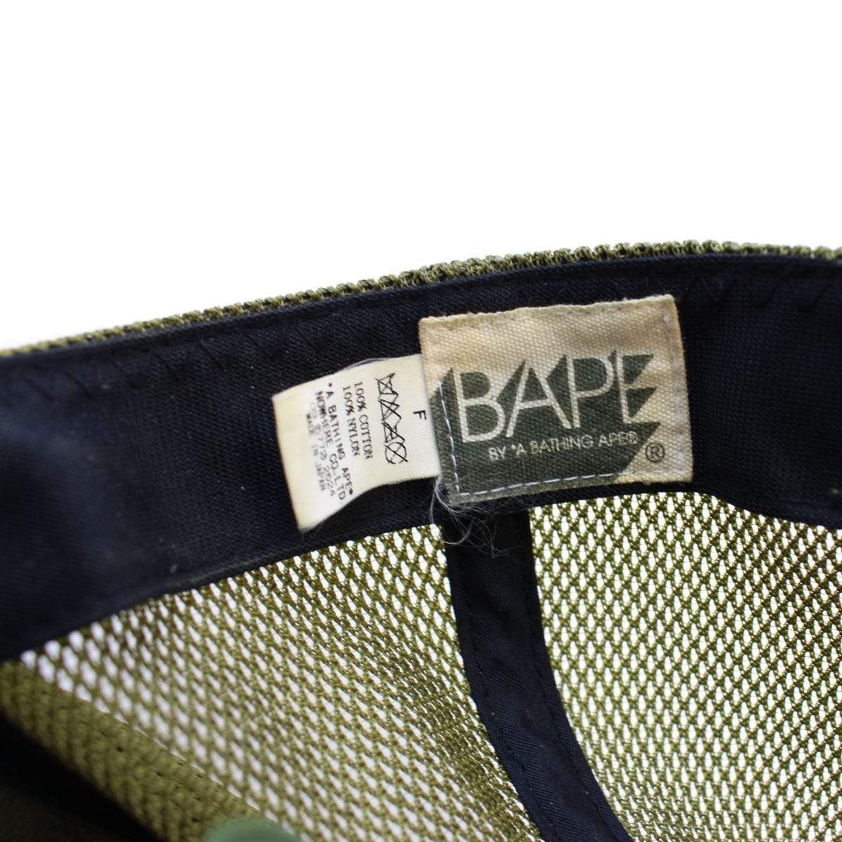 Bape x Kaws 1st Green Camo Trucker Hat - SaruGeneral