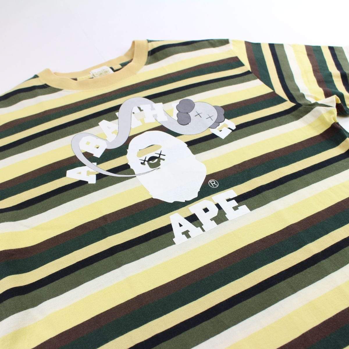 bape x kaws yellow striped college logo tee - SaruGeneral