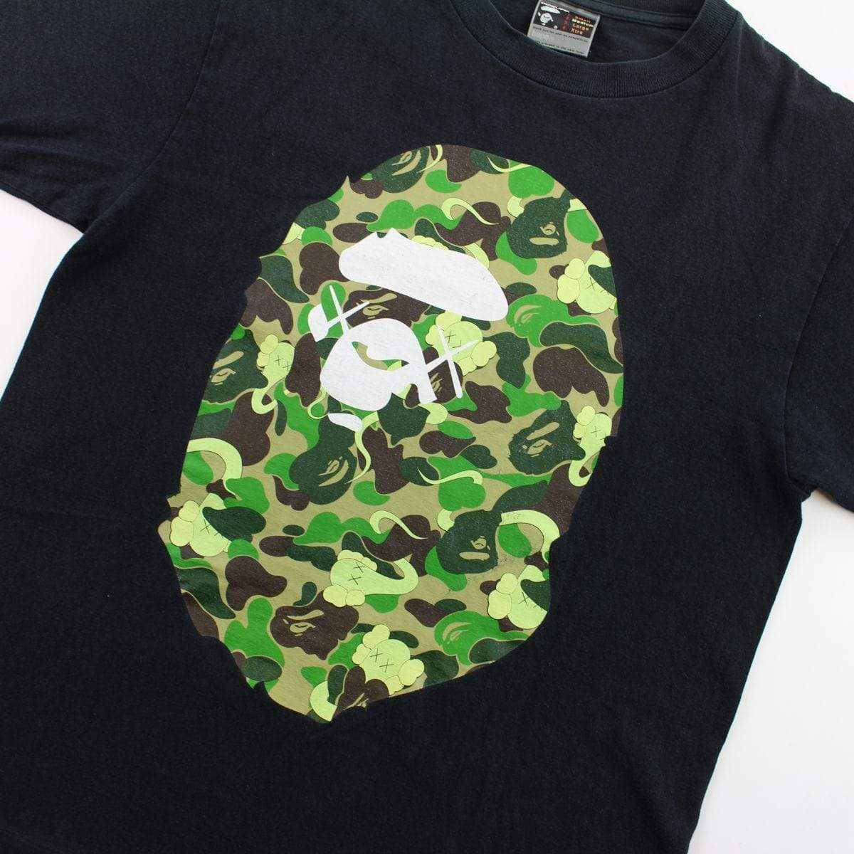 Bape x Kaws ABC Green Camo Big Ape Logo Tee Black – SARUGENERAL