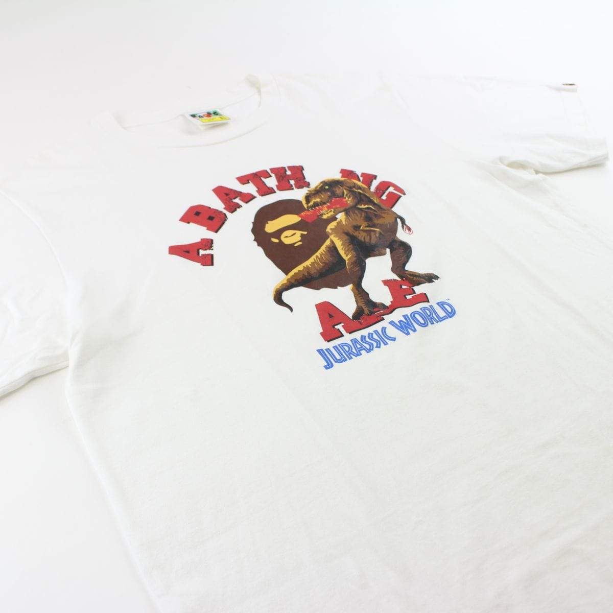 Bape x Jurassic World College Logo Tee White - SaruGeneral